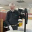 Fig. 1 John McIver Photographing the Visitors' Book